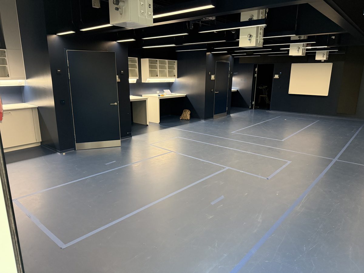 The new, empty laboratory with tape outlines marking where optical tables will stand.