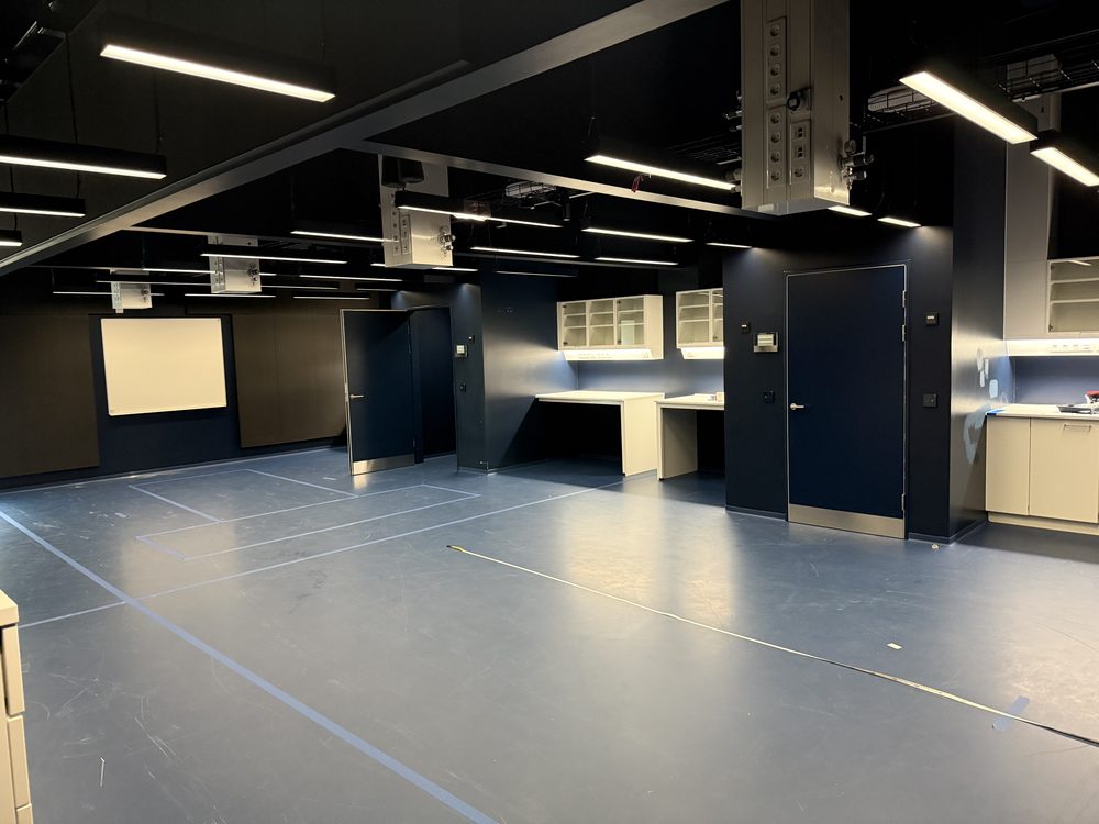 The empty laboratory with tape outlines for optical tables.